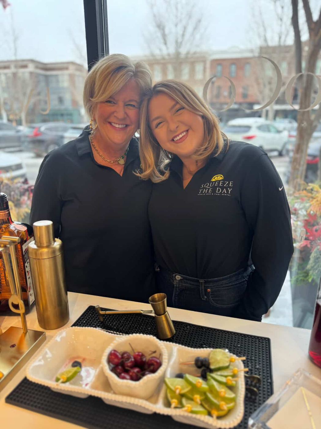 Linda and Kenzie behind their styled bar