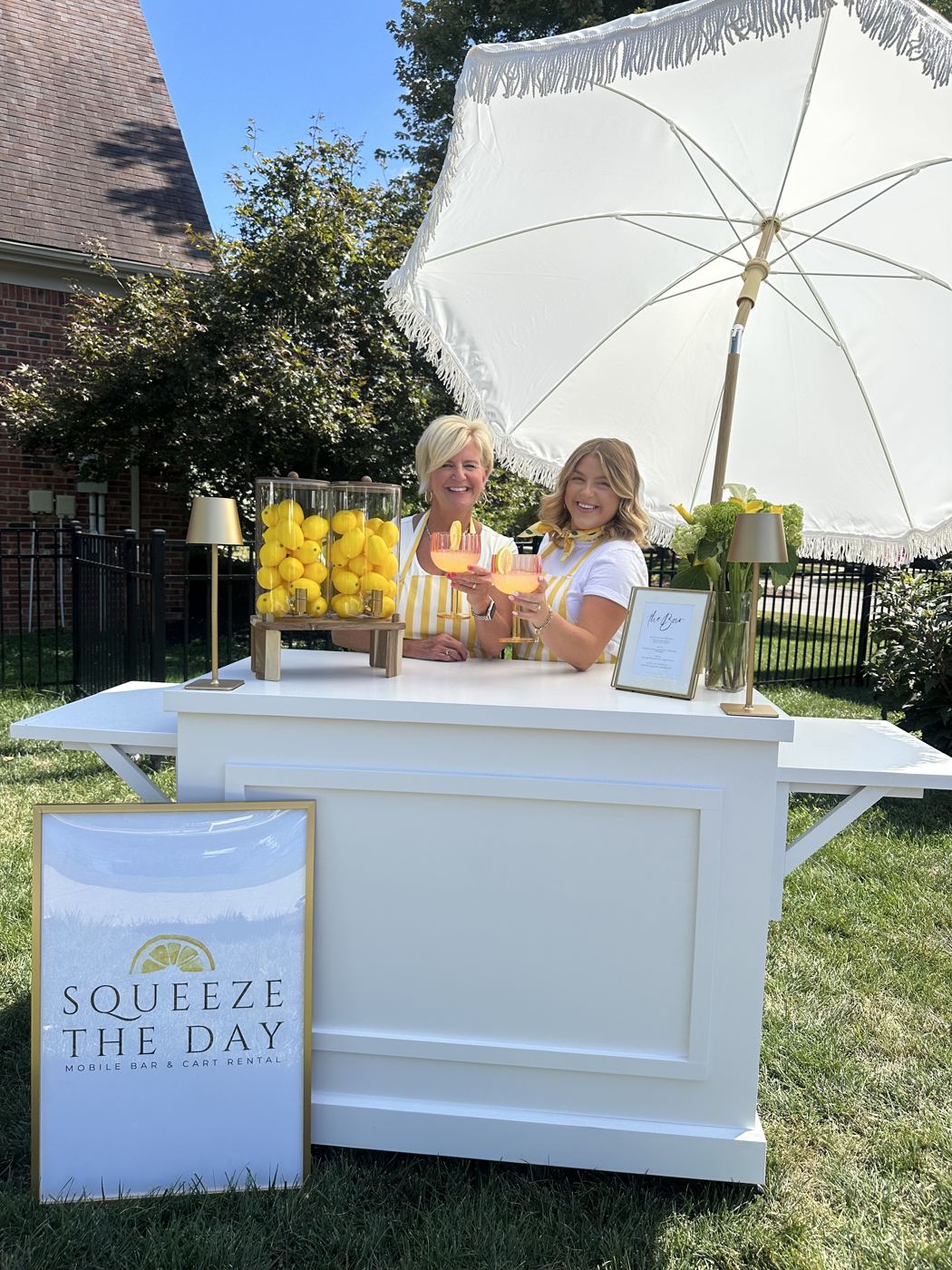Styled bar under a fringed white umbrella