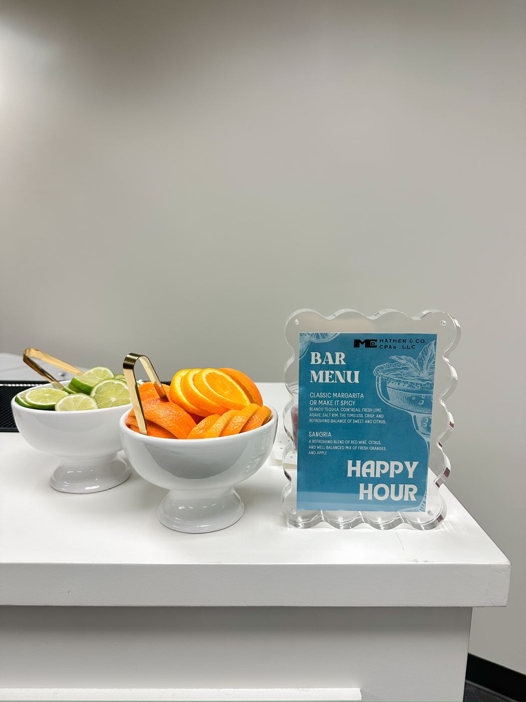Garnish bowls beside a custom bar menu