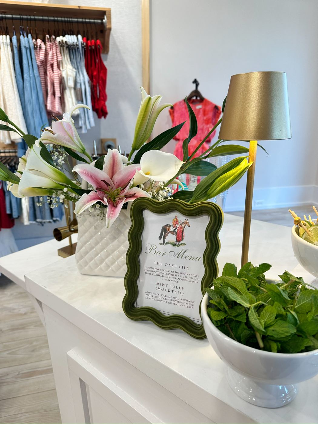 Florals and a framed menu on the styled bar